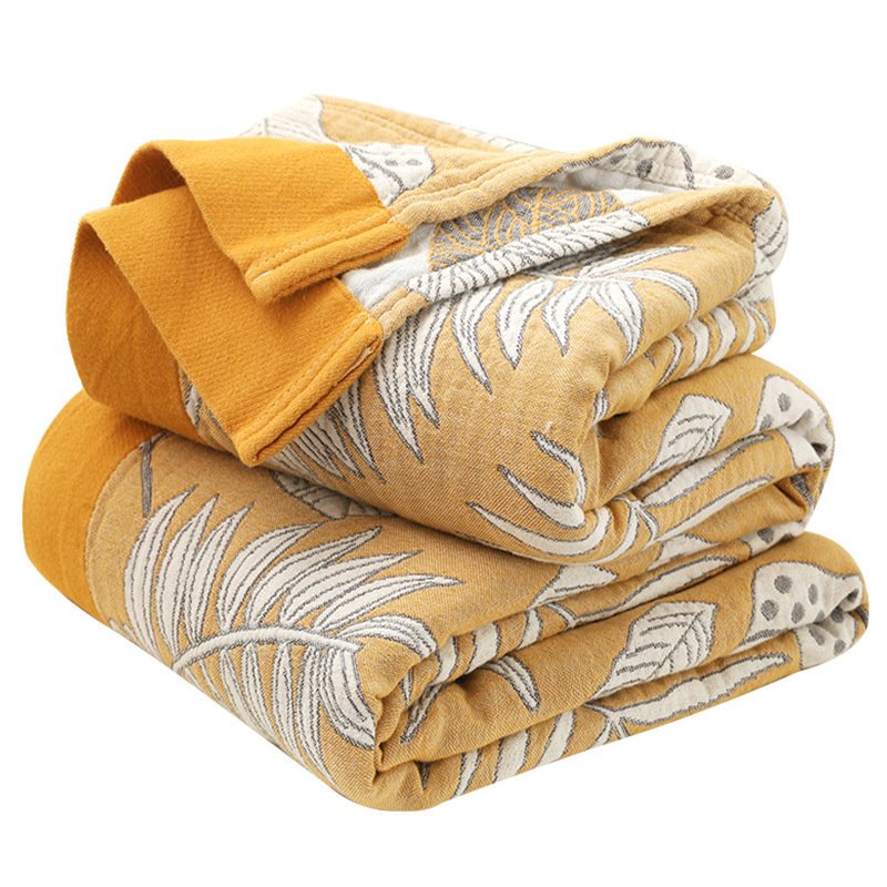“Leaf Pattern Cotton Blanket” – Pamučna dekorativna deka sa modernim motivima listova