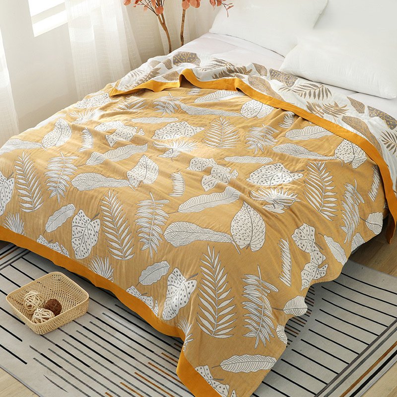 “Leaf Pattern Cotton Blanket” – Pamučna dekorativna deka sa modernim motivima listova